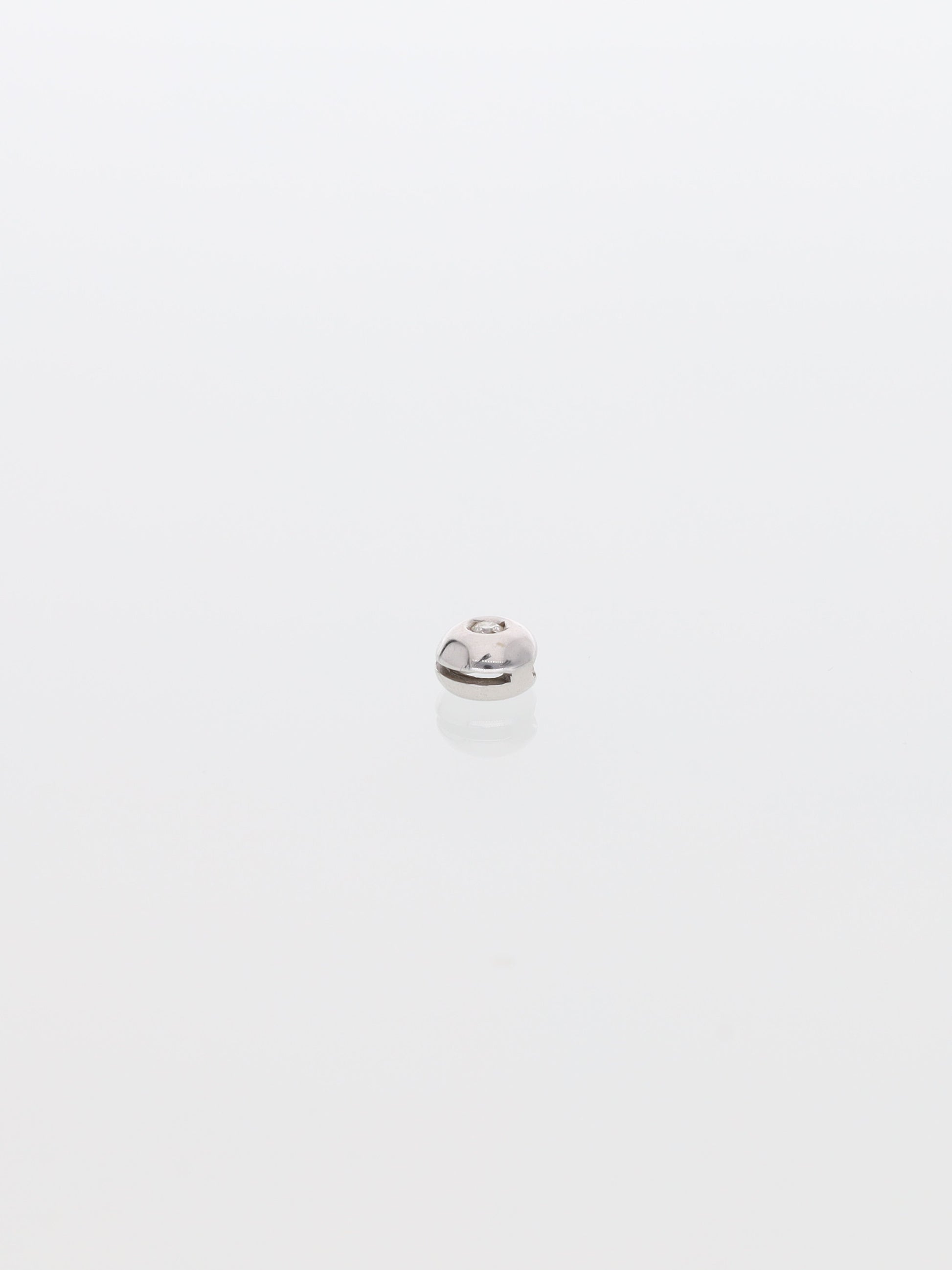 Ciondolo in oro bianco 18kt punto luce 0.03ct